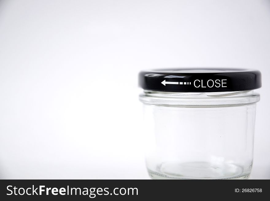 Close up text close on glass jar. Close up text close on glass jar