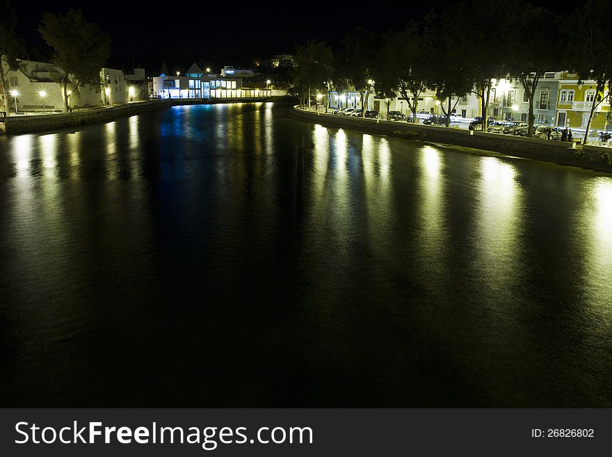 View of beautiful Tavira city in the night located in the Algarve, Portugal. View of beautiful Tavira city in the night located in the Algarve, Portugal.