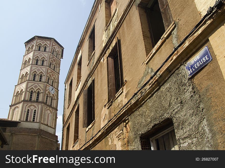 View from approaching street of the octagonal bell tower in Lombez, southern France. View from approaching street of the octagonal bell tower in Lombez, southern France