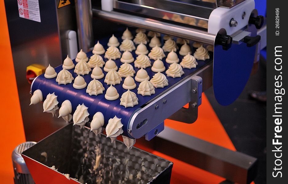 A modern machinery producing cakes. A modern machinery producing cakes