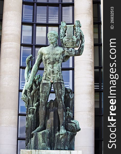 Old Green Apollo Statue In Paris, France