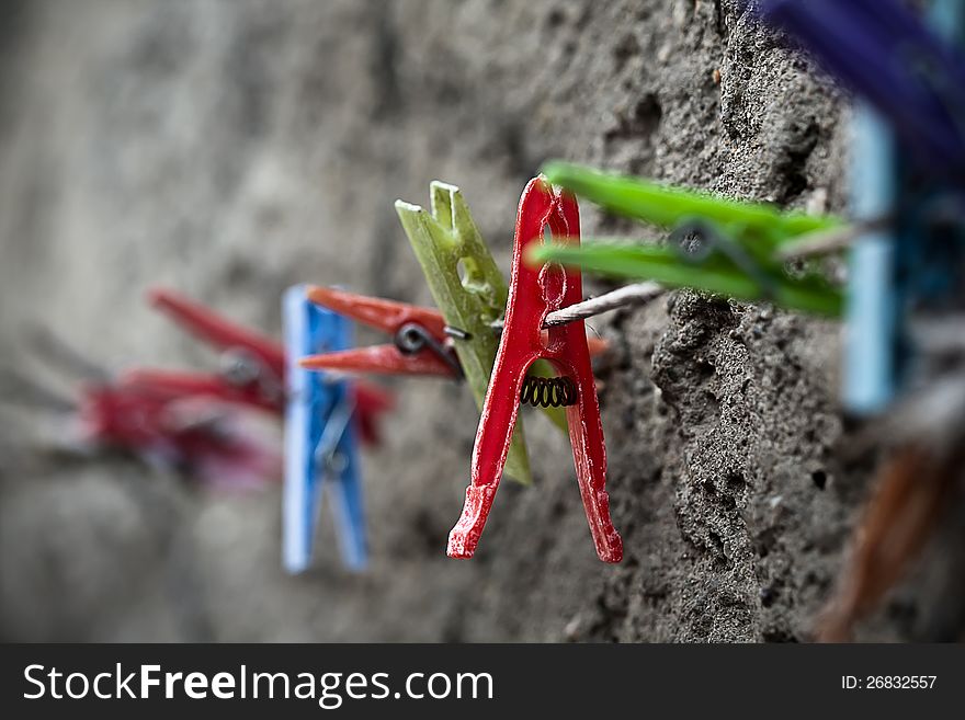 Clothespins. Focus on the red one.