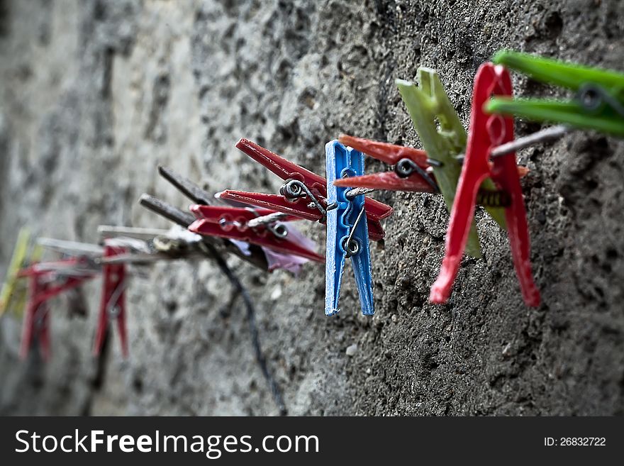 Clothespins. Focus on the blue one.