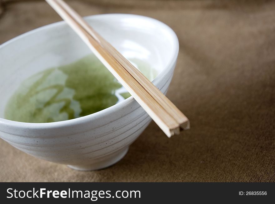 Close up chopstick on japanese bowl. Close up chopstick on japanese bowl