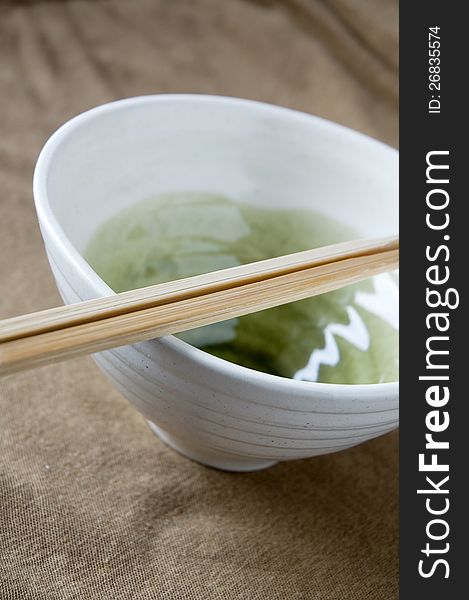 Chopstick on white bowl