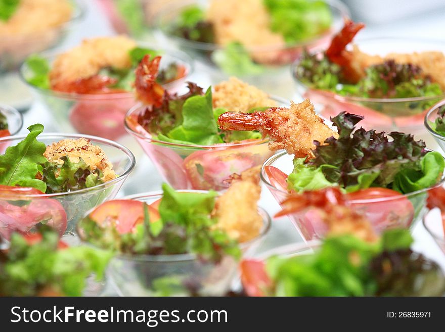 Row shrimps cocktail salad on white background