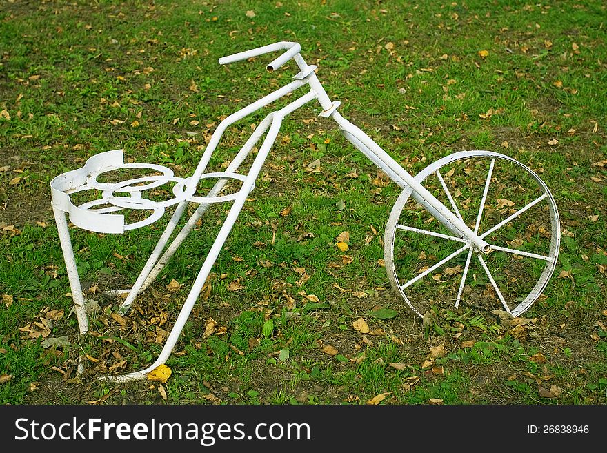 Model bike on the lawn, as an element of landscape design