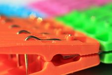 Colored Plastic Clothes Pegs Stock Image
