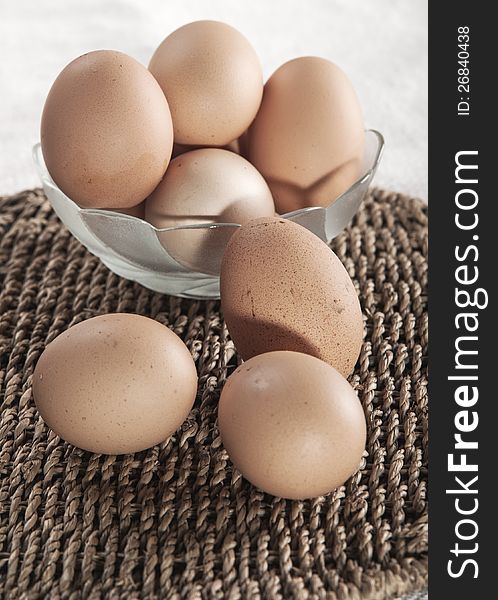 Eggs in glass bowl  on the table
