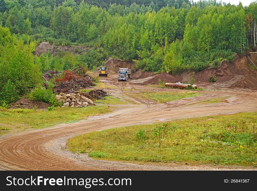 A dump truck being loaded with gravel. A dump truck being loaded with gravel