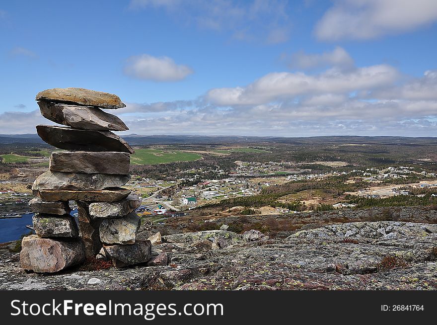 Many such monuments dot the hillsides and mountains around Newfoundland as a way of telling people that somebody was at this point. This particular sits on a mountain top overlooking Bay Bulls Near St John's Newfoundland in Canada. Many such monuments dot the hillsides and mountains around Newfoundland as a way of telling people that somebody was at this point. This particular sits on a mountain top overlooking Bay Bulls Near St John's Newfoundland in Canada.