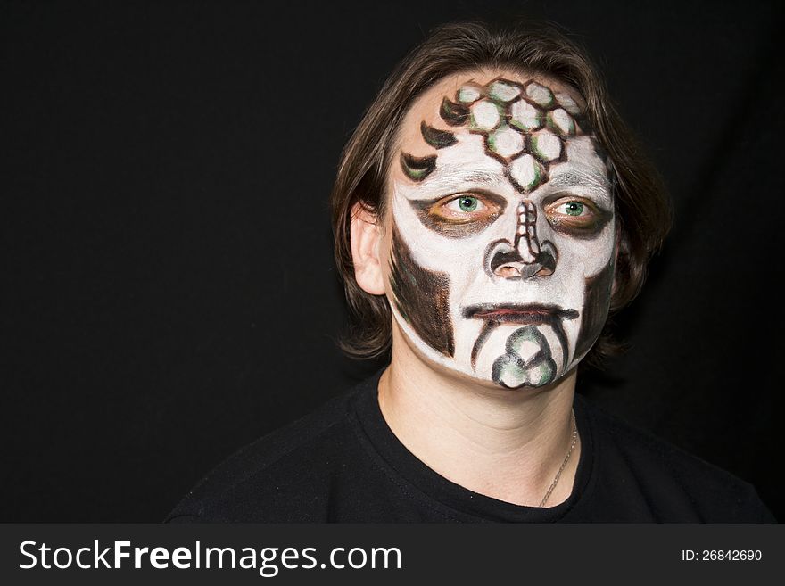 Make-up of a dragon on a man&#x27;s face