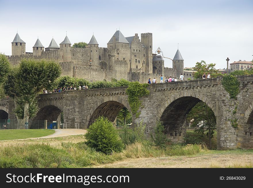 The beautiful fortified town of Carcassonne and Pont Vieux bridge in Southern France, seen from across the Aude river. The beautiful fortified town of Carcassonne and Pont Vieux bridge in Southern France, seen from across the Aude river