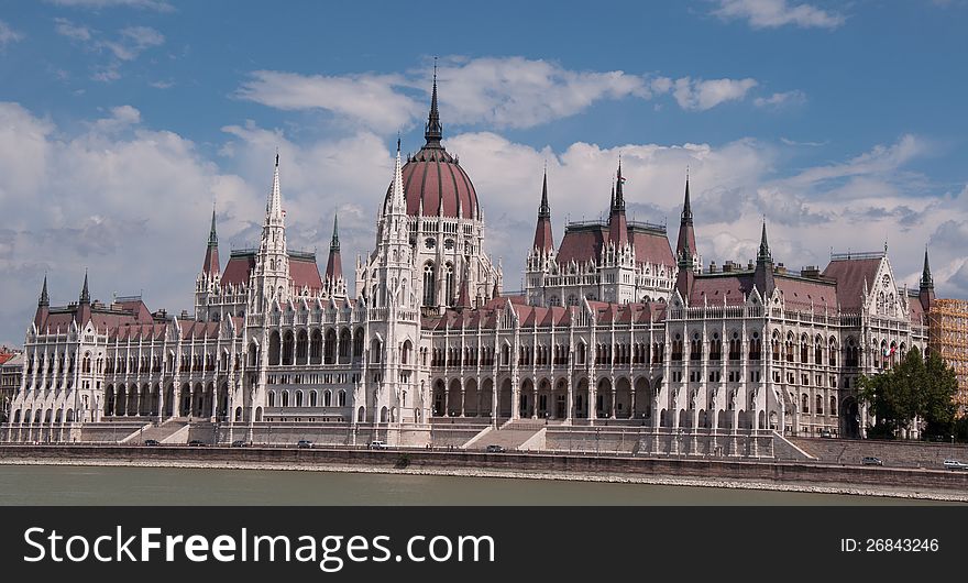 Hungarian Parliament in a sunny day - details of architecture and the cupola. Hungarian Parliament in a sunny day - details of architecture and the cupola