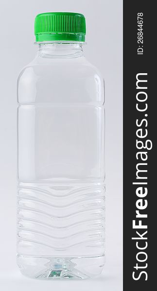 Drinking water in clear bottle on white