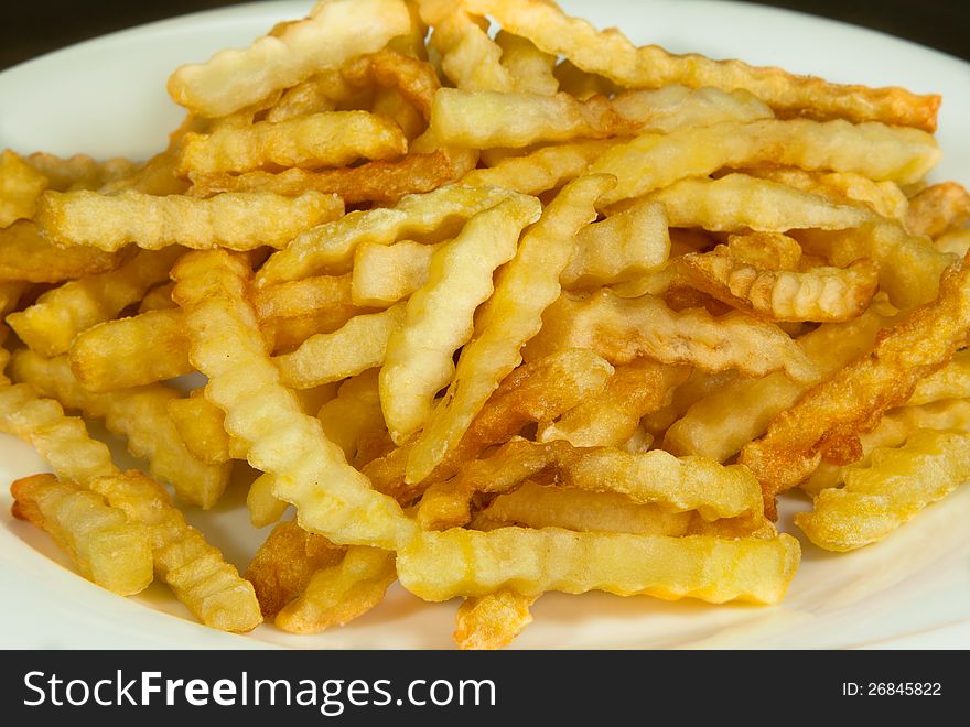 Baked french fries on the dish