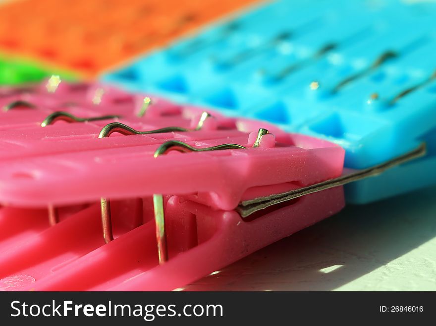 Colored plastic clothes pegs