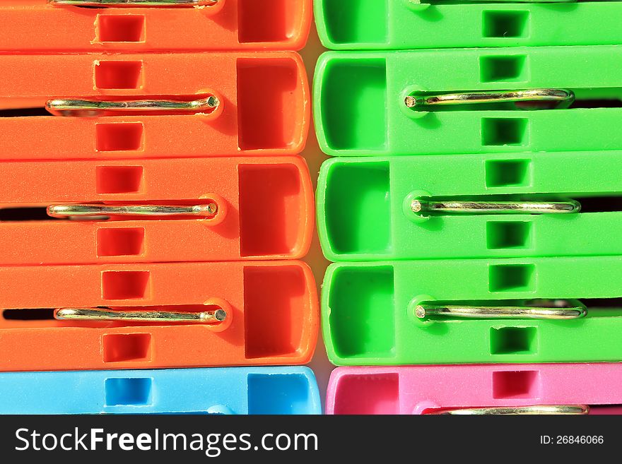 Colored plastic clothes pegs