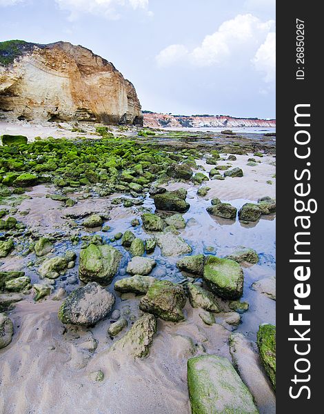 View of the beautiful coastline near Olhos D'Agua in the Algarve, Portugal. View of the beautiful coastline near Olhos D'Agua in the Algarve, Portugal.