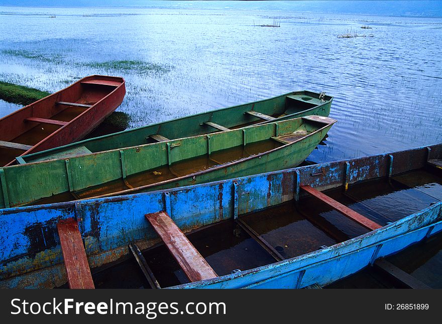 Rusty boats in lashi lake, Lijiang, China, 2005.