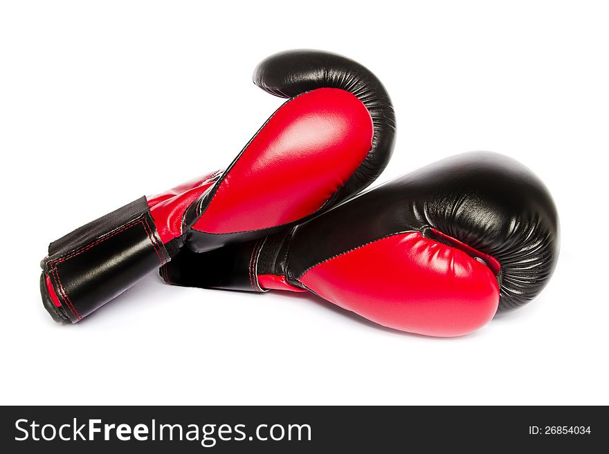 Close view of some red boxing gloves isolated on a white background.