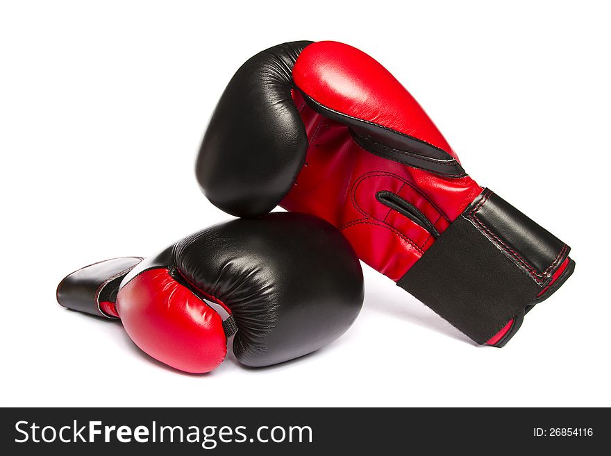 Close view of some boxing gloves isolated on a white background.
