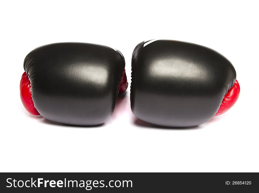 Close view of some boxing gloves isolated on a white background.