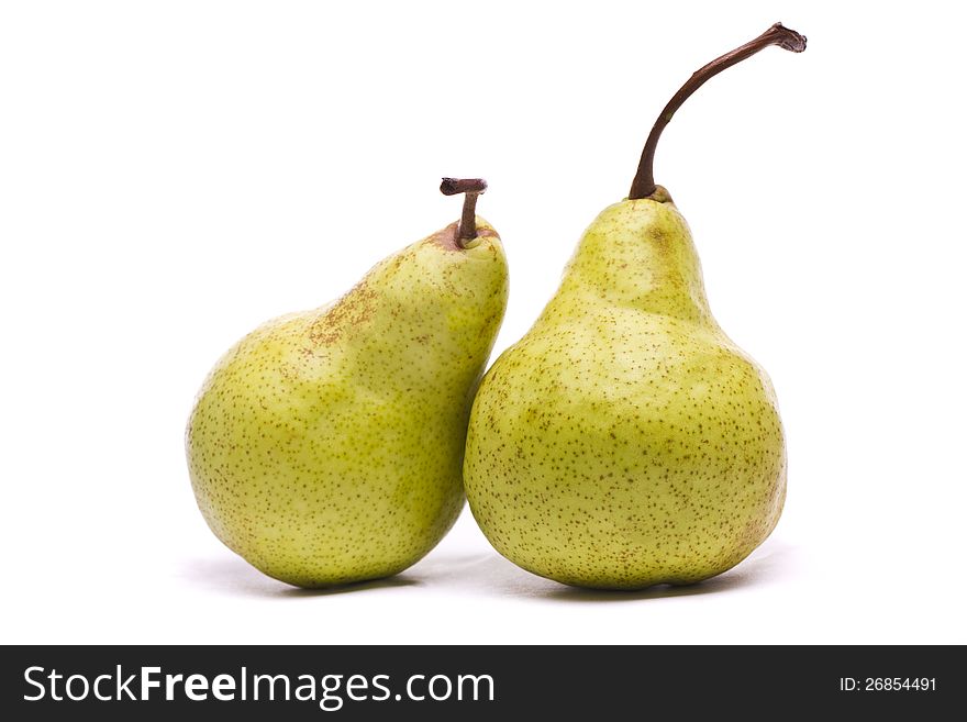 Close view of some tasty green pears isolated on a white background. Close view of some tasty green pears isolated on a white background.