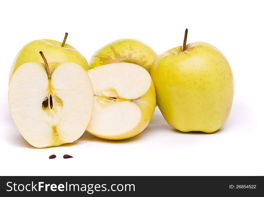 Close view of some tasty yellow apples isolated on a white background. Close view of some tasty yellow apples isolated on a white background.