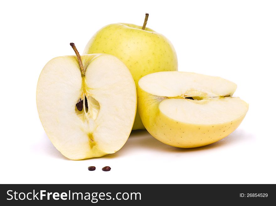Close view of some tasty yellow apples isolated on a white background. Close view of some tasty yellow apples isolated on a white background.