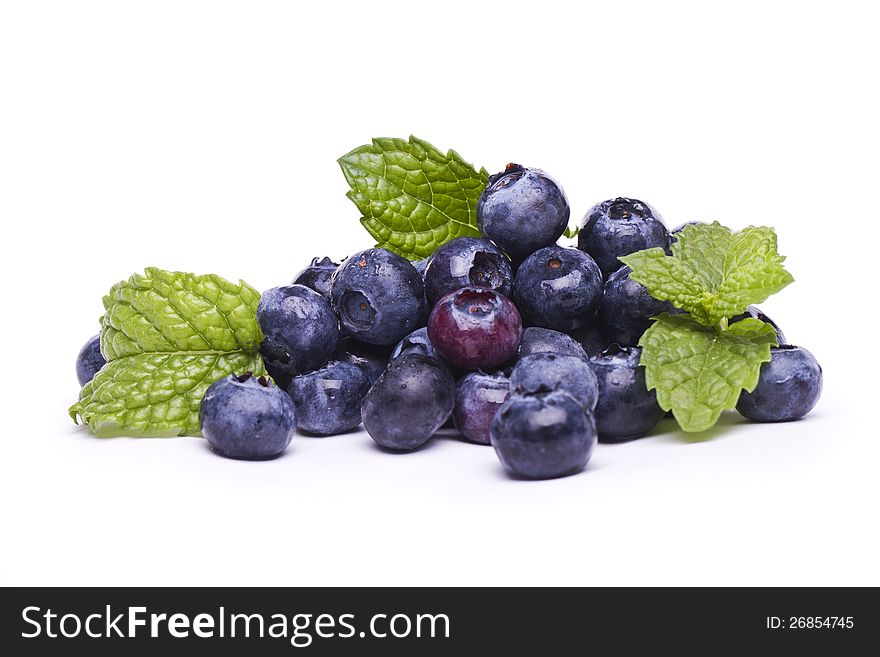 View of a bunch of tasty blueberries (Vaccinium myrtillus) isolated on a white background.