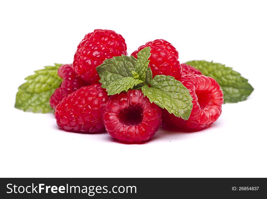 View of several tasty raspberries isolated on a white background.