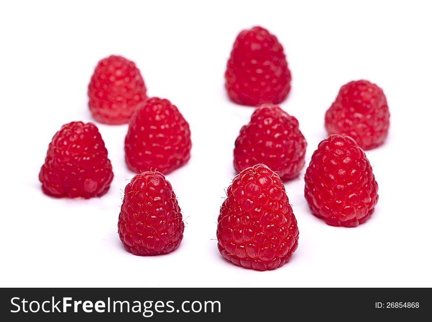 View of several tasty raspberries isolated on a white background.