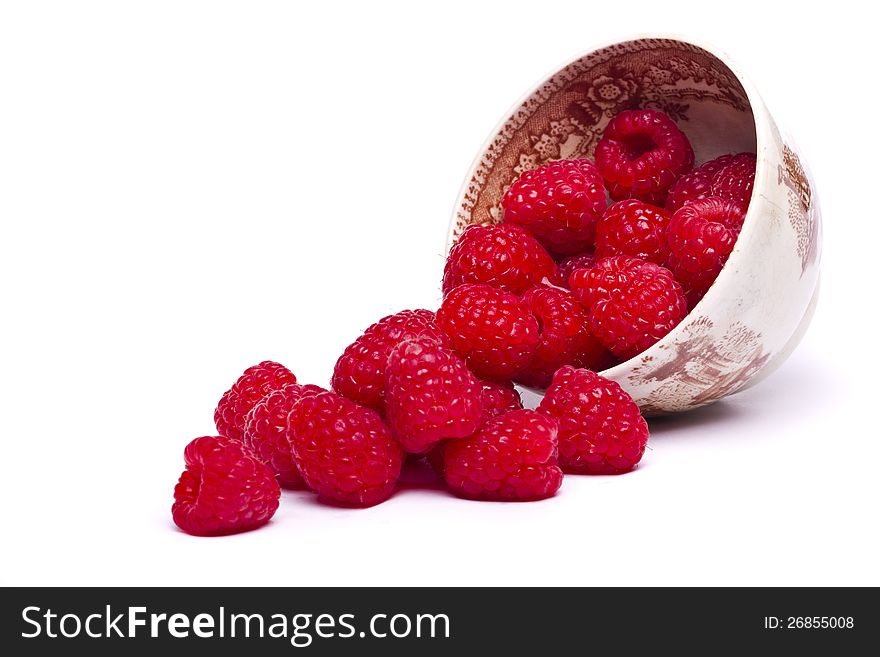 View of two tasty raspberries isolated on a white background.