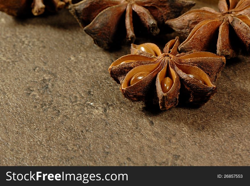 Several stars of anise on a kitchen table. Several stars of anise on a kitchen table.