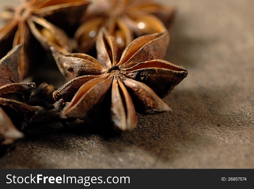 Several stars of anise on a kitchen table. Several stars of anise on a kitchen table.