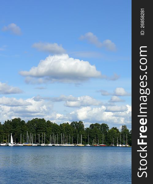 Blue sky and water with yachts beyond. Blue sky and water with yachts beyond.