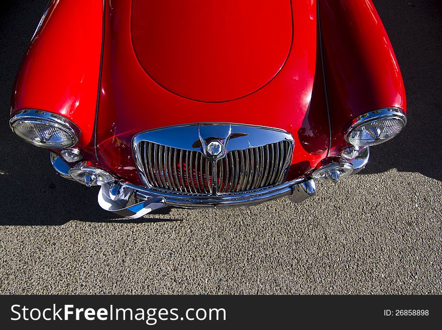 Detail view of a vintage car on display on a city. Detail view of a vintage car on display on a city.