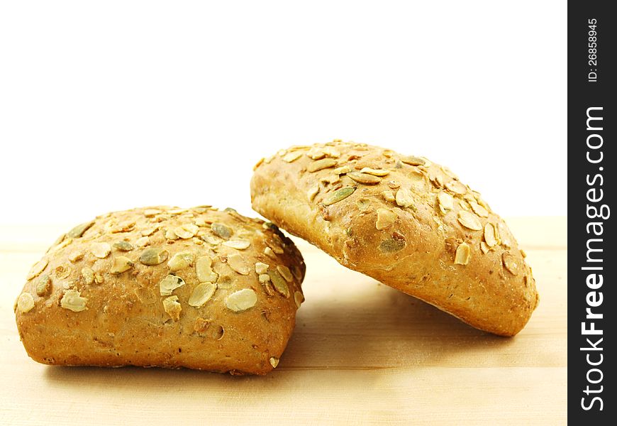 Bread with seeds  on a wooden board