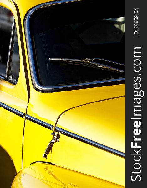 Detail view of a vintage car on display on a city. Detail view of a vintage car on display on a city.