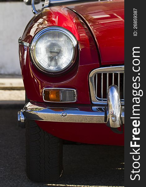 Detail view of a vintage car on display on a city. Detail view of a vintage car on display on a city.