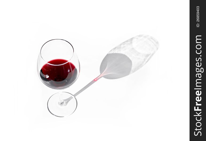 Glass of red wine on a white background with soft shadow. Glass of red wine on a white background with soft shadow.