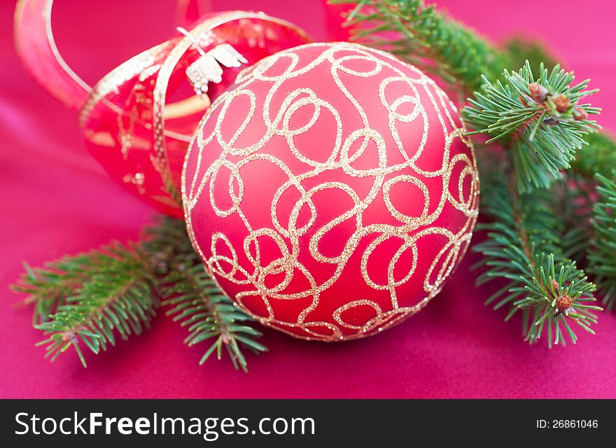 Christmas bauble on the red silk  background. Christmas bauble on the red silk  background