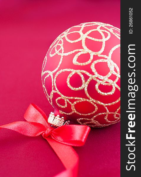 Christmas bauble on the red silk  background