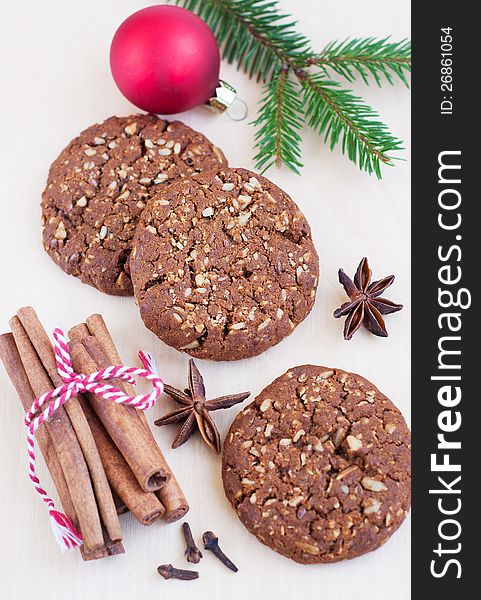 Christmas cookies,nuts and spices on wooden table