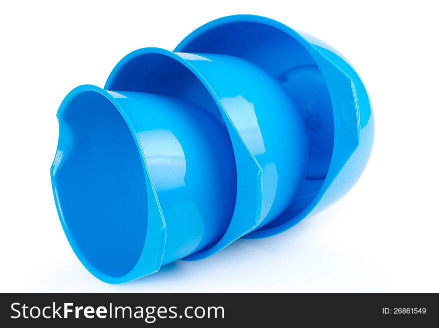 Three different size plastic bowls, white background