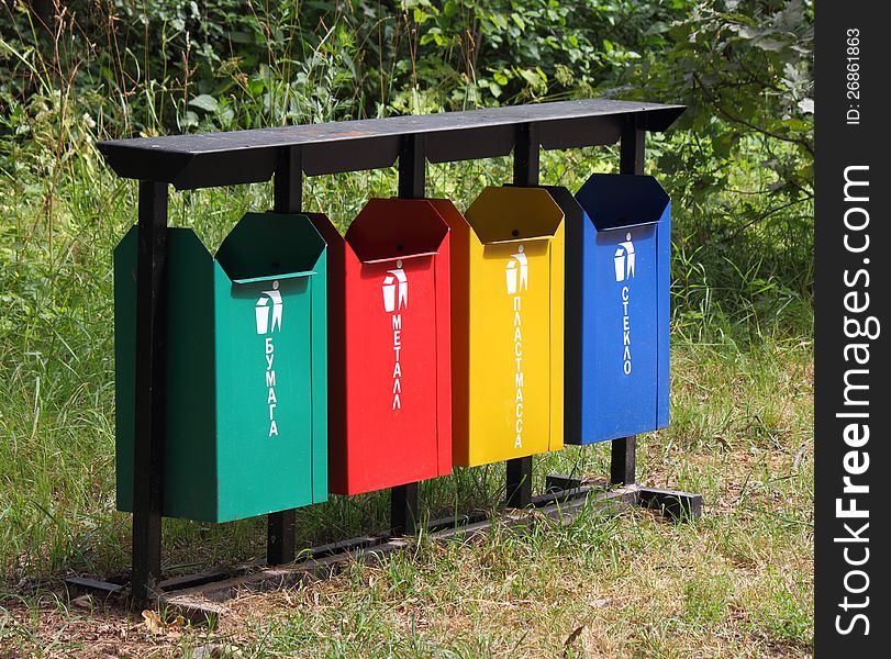 Four colored garbage containers