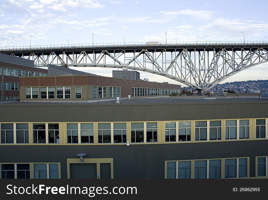 Boxy office buildings under bridge