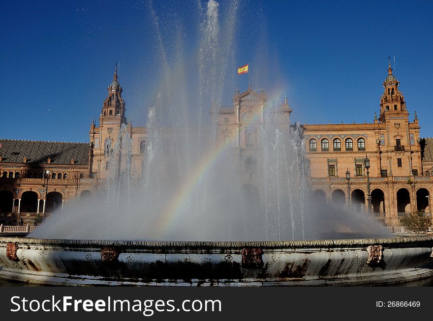 Small rainbow in the Fountain Plaza of Spain in Seville