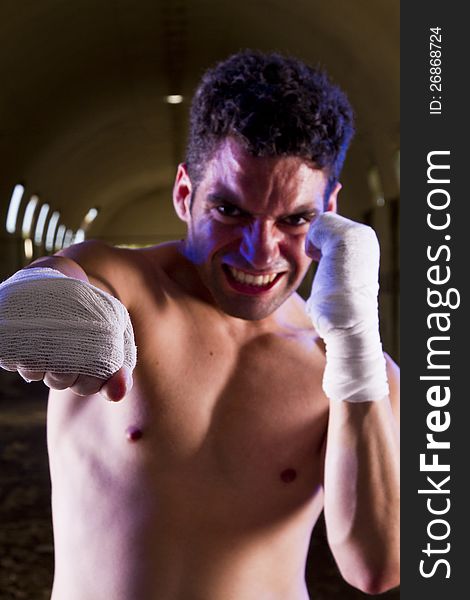 View of a fit fighter on a abandoned factory.